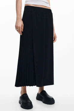 Falda midi pliegues