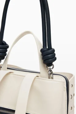 Mochila efecto piel círculos
