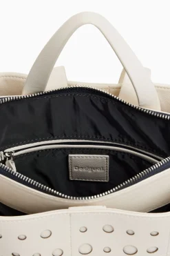 Mochila efecto piel círculos