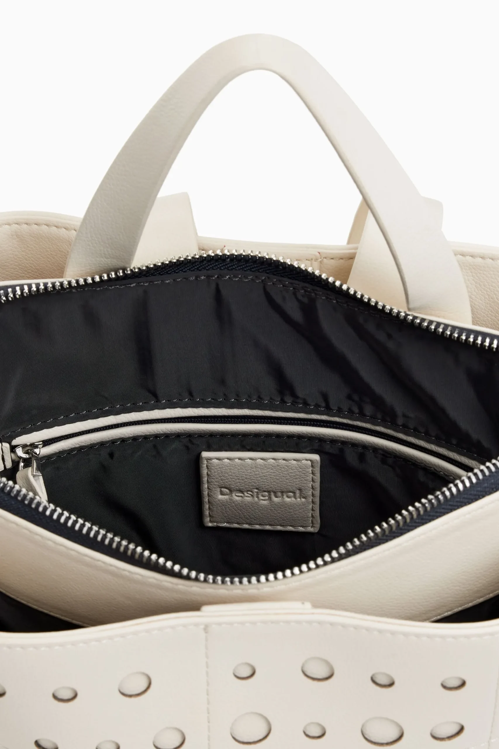 Mochila efecto piel círculos