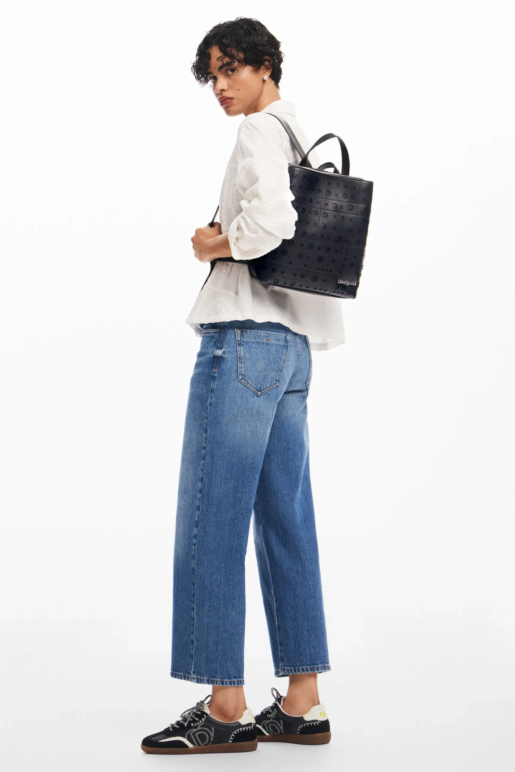 Mochila efecto piel círculos