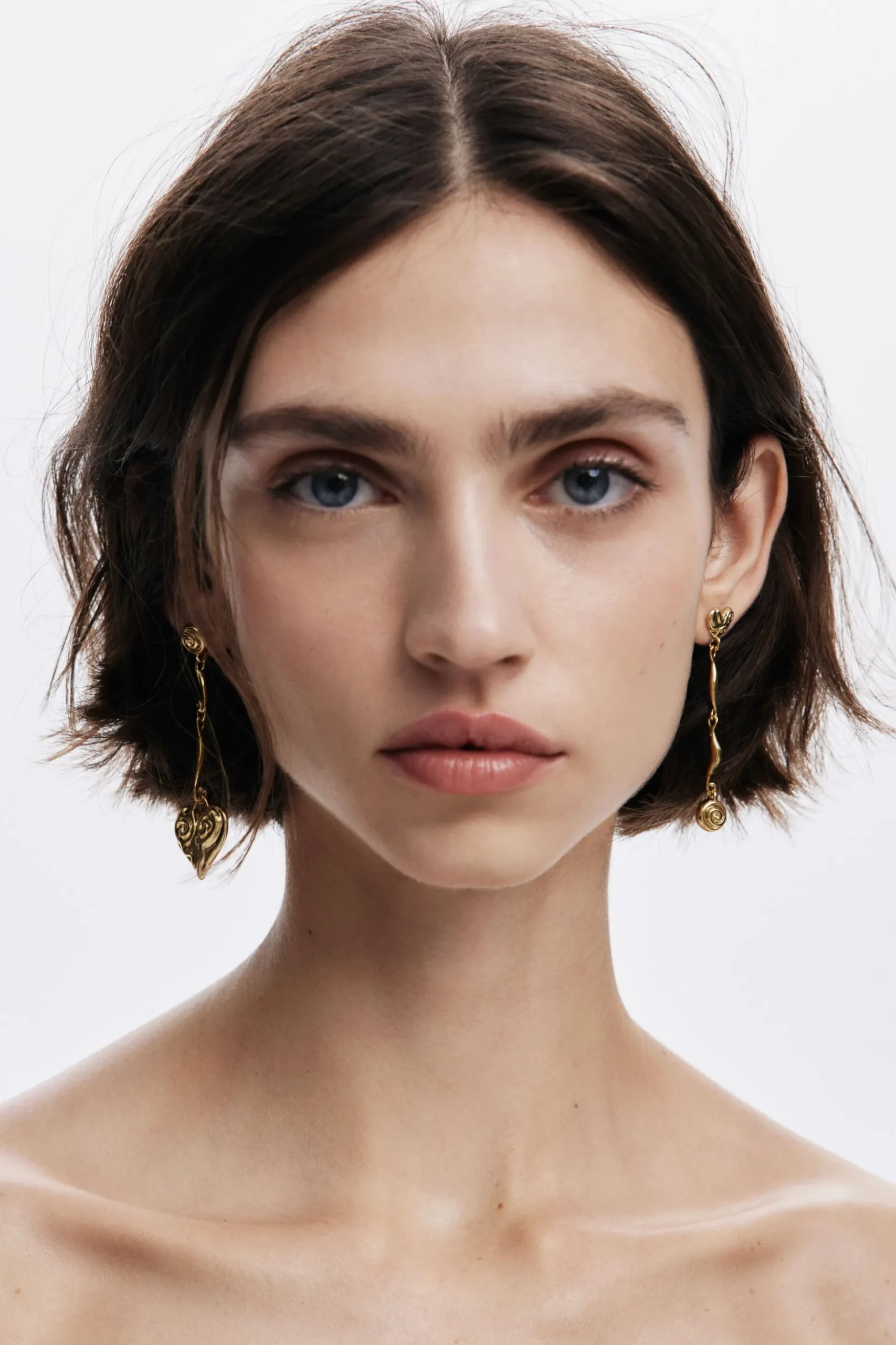 Pendientes asimétricos baño oro Zalio